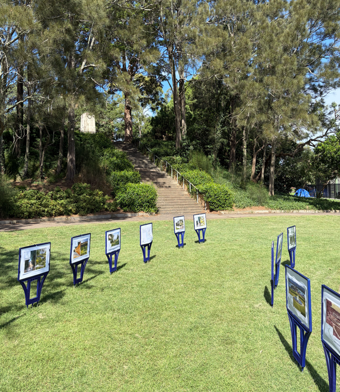 a green park with concept design signs in displayed